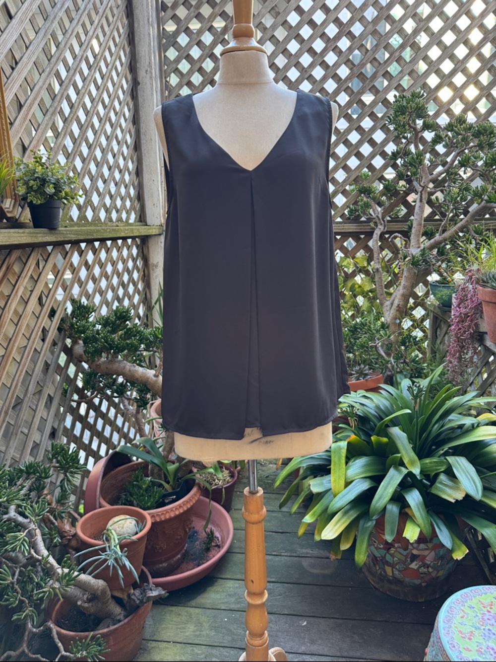 H&M Sleeveless V-Neck top in Black.  Size 12. Inverted front pleat. NWT